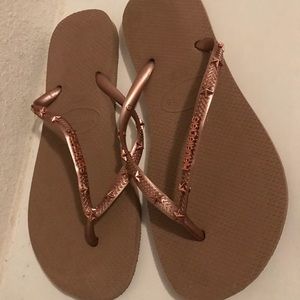 Gold Havaianas flip flops